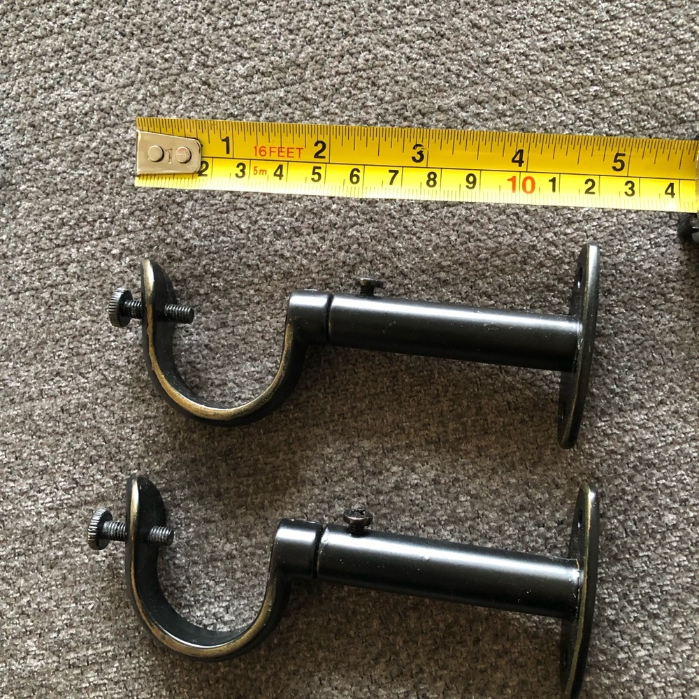 Black curtain rod wall bracket